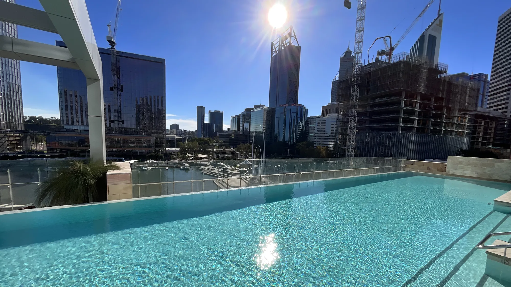 Architectural glass and city skyline in Perth