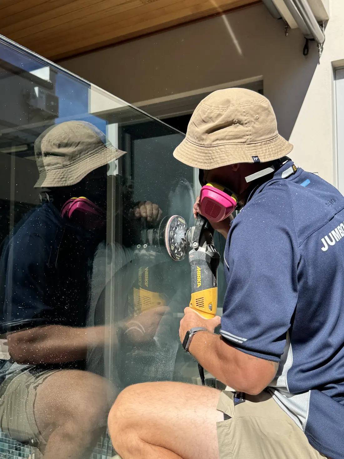 Close work removing scratching from architectural glass